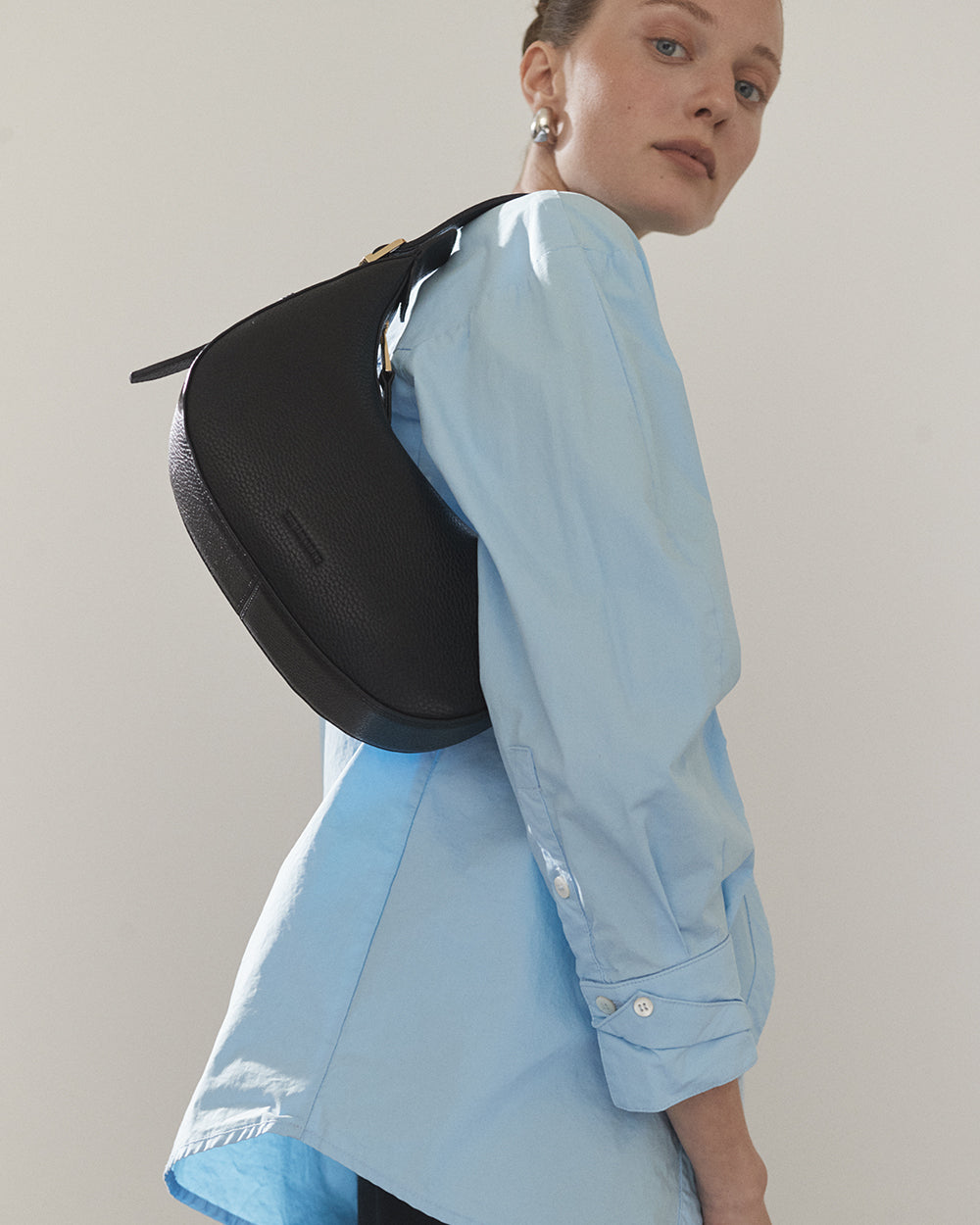 Friday Bag: Leather Crescent Bag in Black with Gold | The Horse
